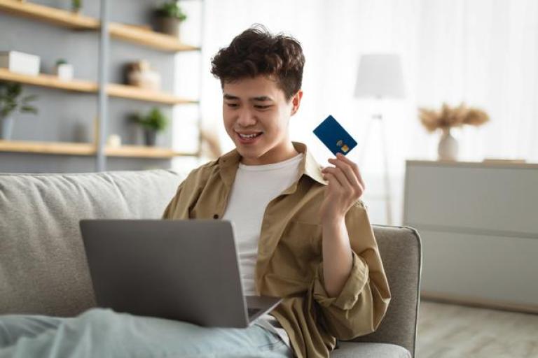 man-credit-card-couch-sm.jpg